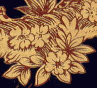 gilt picture of flowers on plate