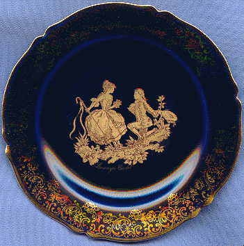 small limoges dark blue and gilt porcelain plate, showing lovers