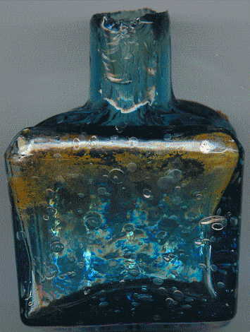 aqua glass victorian ink bottle with original broken-off neck and many many bubbles: back view