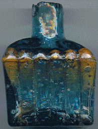 aqua glass victorian ink bottle with original broken-off neck and many many bubbles: front view