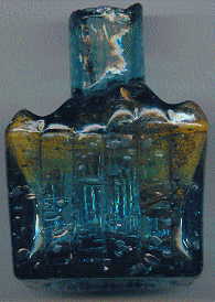 aqua glass victorian ink bottle with original broken-off neck and many many bubbles: left view