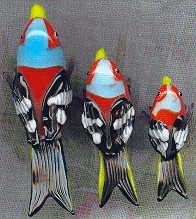 three bright glass birds, view from above