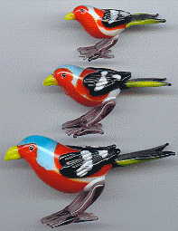 three bright glass birds, view from left