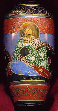 japanese vase, showing man with bald head in japanese traditional costume, seated