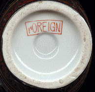 base of vase,  with the word,  'FOREIGN.'