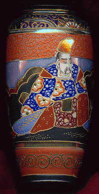 japanese vase, showing man with hat in traditional japanese costume, seated.