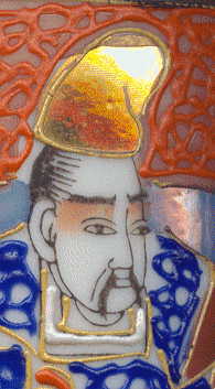 close-up of man's head, wearing traditional japanese hat.