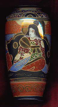 japanese vase showing lady in traditional japanese costume, seated.