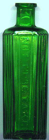 hexagonal green poison bottle: front view with raised letters and ribbed sides