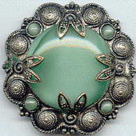 1940s? brooch with green satin glass cabochons