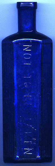 medium-large bristol blue victorian poison bottle. it says: NOT TO BE TAKEN