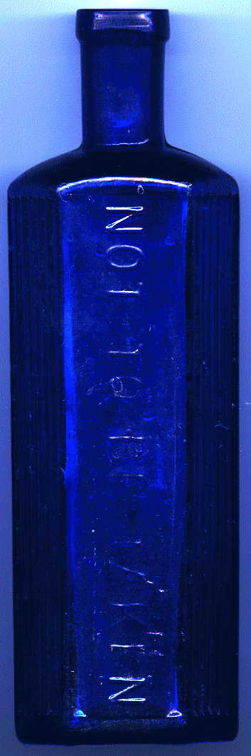 medium-large bristol blue victorian hexagonal poison bottle.  it says: NOT TO BE TAKEN