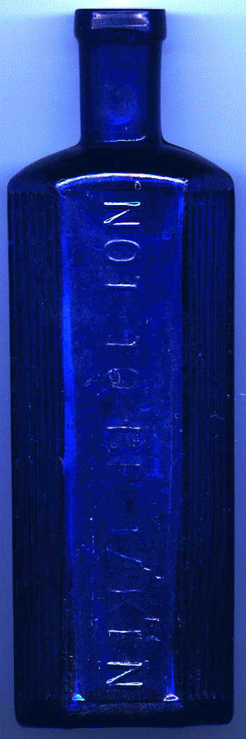 medium-large bristol blue victorian hexagonal poison bottle.  it says: NOT TO BE TAKEN