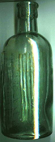 pale green poison bottle: back left view