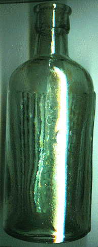 pale green poison bottle: back right view