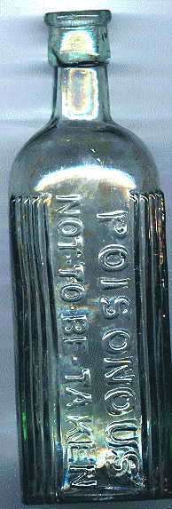 pale green poison bottle: front view showing raised glass letters and ribbed areas