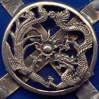 chinese blue ceramic and antiqued pressed metal trinket box: closeup of dragon, bird and pearl motif on top of lid